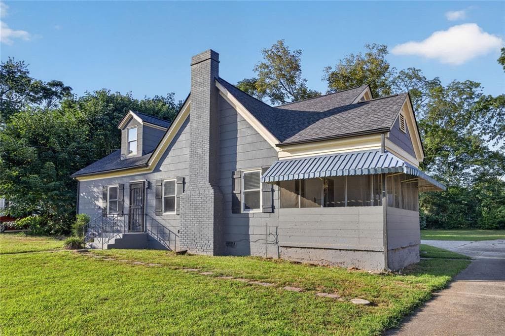 4 bedroom, 2 bathroom, 1,685 sq ft single family residence for sale at 6866 Parkway Drive, Lithonia, GA 30058 — photo 2