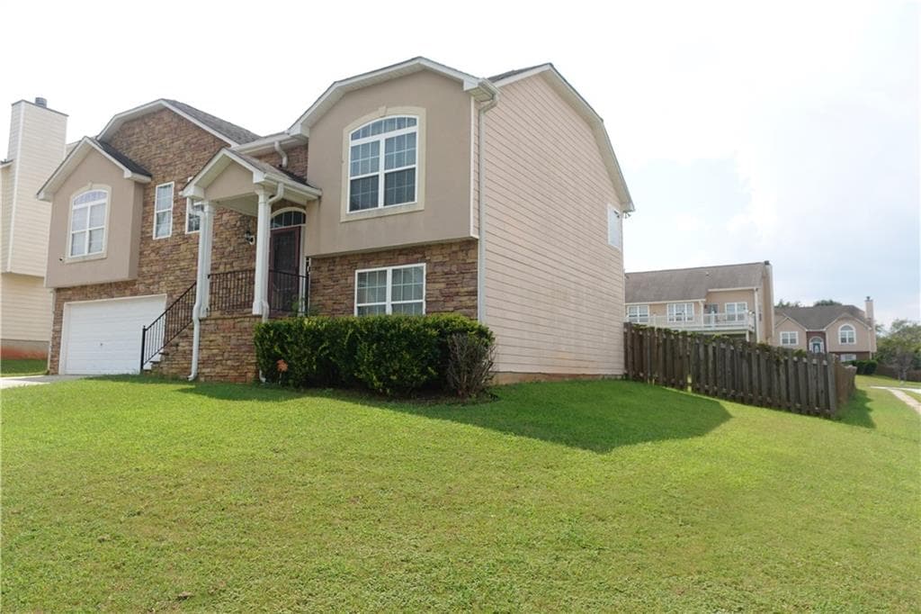 5 bedroom, 3 bathroom, 2,540 sq ft single family residence for sale at 5943 Rex Ridge Court, Rex, GA 30273 — photo 2