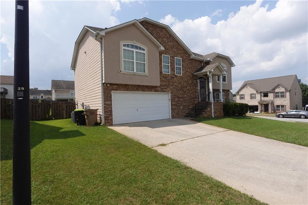5 bedroom, 3 bathroom, 2,540 sq ft single family residence for sale at 5943 Rex Ridge Court, Rex, GA 30273 — photo 3