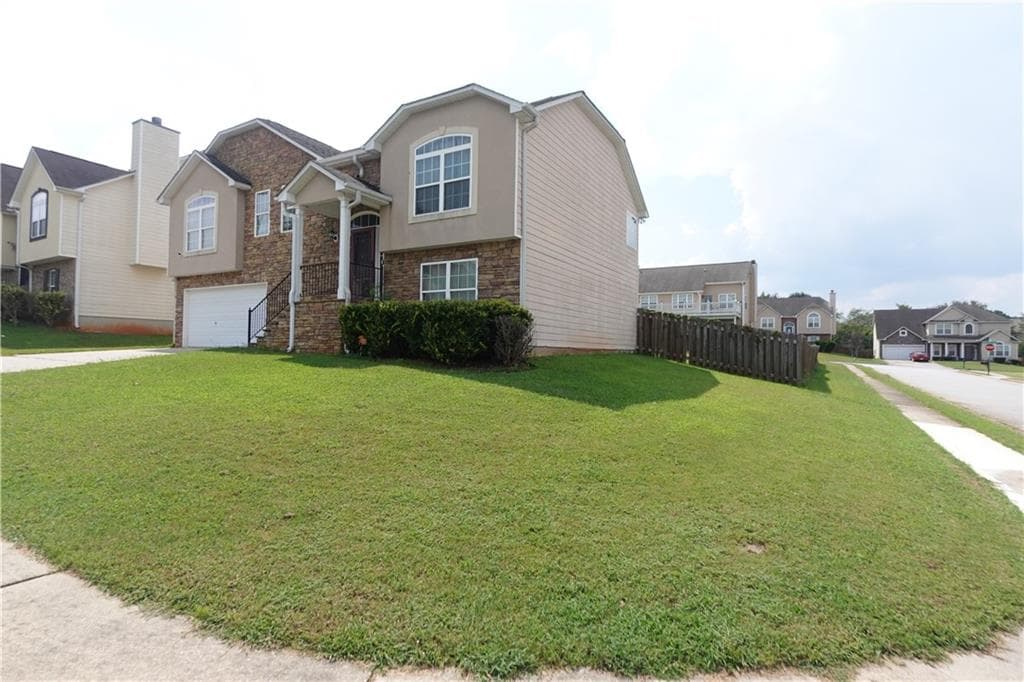 5 bedroom, 3 bathroom, 2,540 sq ft single family residence for sale at 5943 Rex Ridge Court, Rex, GA 30273 — photo 4