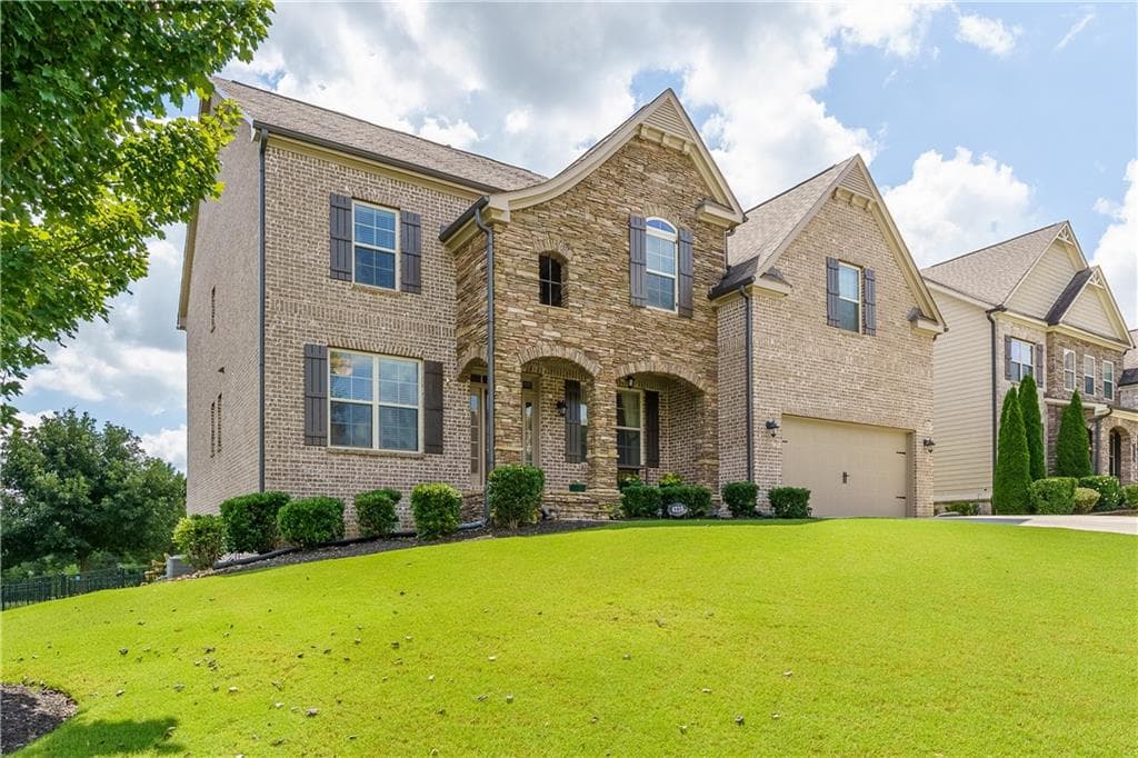 5 bedroom, 4 bathroom, 4,285 sq ft single family residence for sale at 4210 Woodward Walk Lane, Suwanee, GA 30024 — photo 2