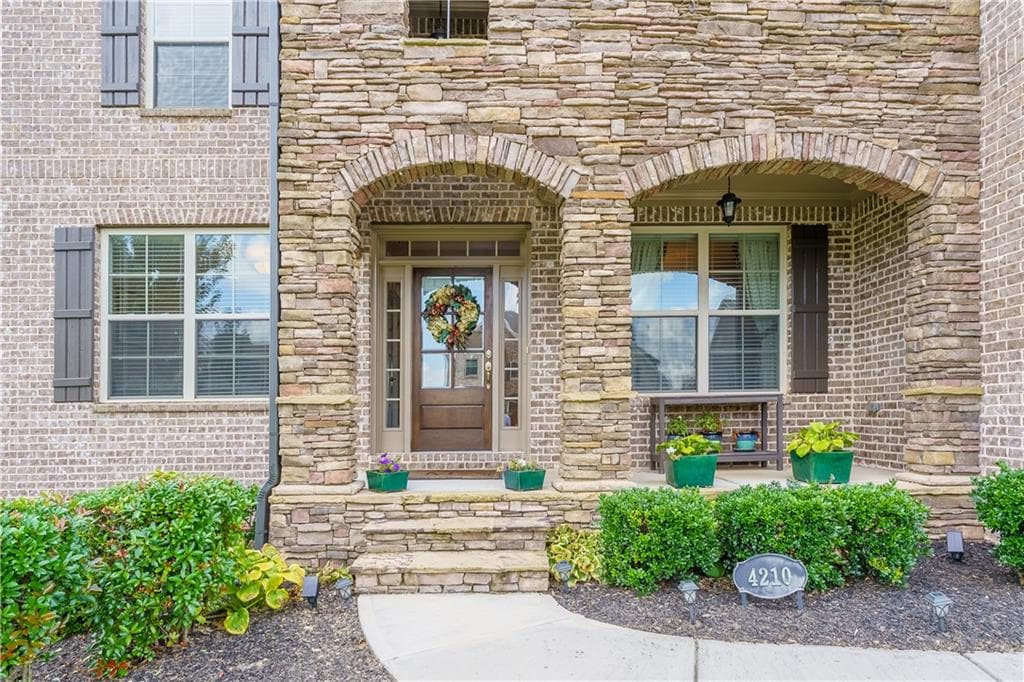 5 bedroom, 4 bathroom, 4,285 sq ft single family residence for sale at 4210 Woodward Walk Lane, Suwanee, GA 30024 — photo 4