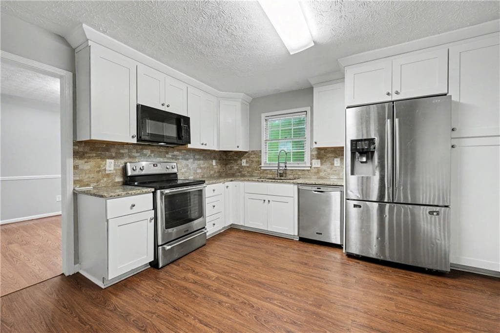 4 bedroom, 3 bathroom, 2,231 sq ft single family residence for sale at 4732 Hickory Court, Lilburn, GA 30047 — photo 6