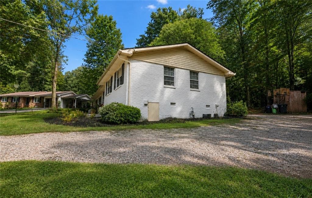 4 bedroom, 2 bathroom, 1,276 sq ft single family residence for sale at 4435 Winding Creek Drive, Cumming, GA 30028 — photo 4
