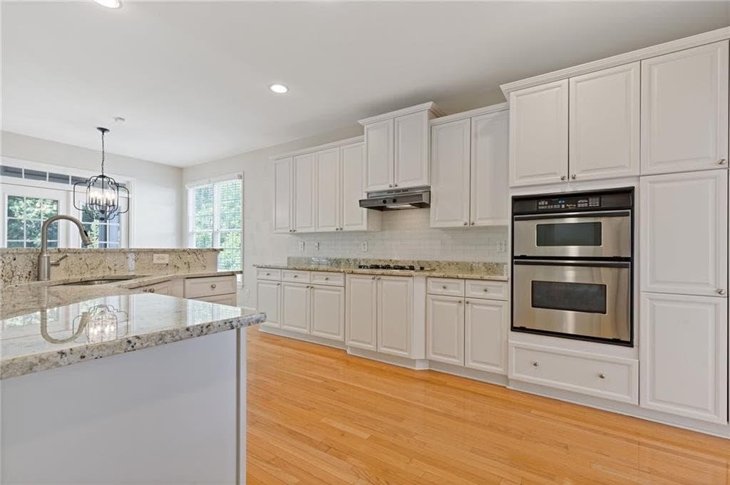 6 bedroom, 5 bathroom, 4,922 sq ft single family residence under contract at 5503 Kingsley Manor, Cumming, GA 30041 — photo 9