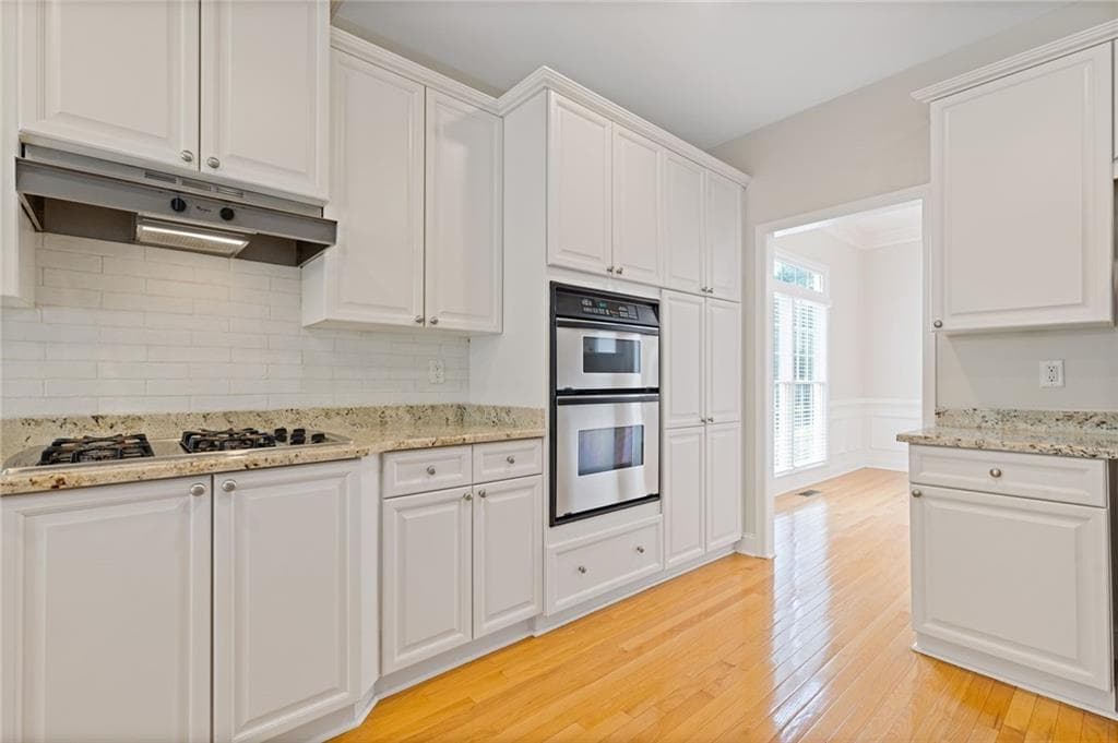 6 bedroom, 5 bathroom, 4,922 sq ft single family residence under contract at 5503 Kingsley Manor, Cumming, GA 30041 — photo 10