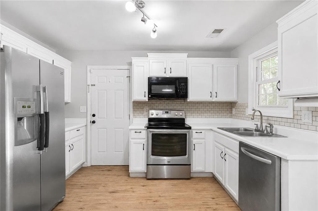 4 bedroom, 3 bathroom, 1,548 sq ft single family residence for sale at 5775 River Ridge Lane, Sugar Hill, GA 30518 — photo 3