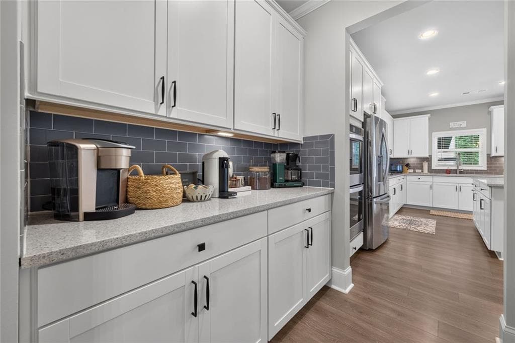 5 bedroom, 3 bathroom, 3,124 sq ft single family residence for sale at 7410 Rambling Vale, Cumming, GA 30028 — photo 6