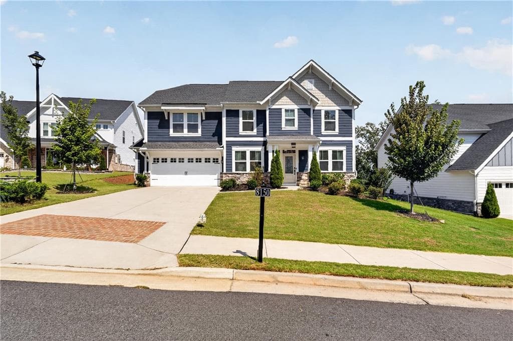 5 bedroom, 3 bathroom, 3,182 sq ft single family residence for sale at 8150 Brewton Bend, Ball Ground, GA 30107 — photo 3