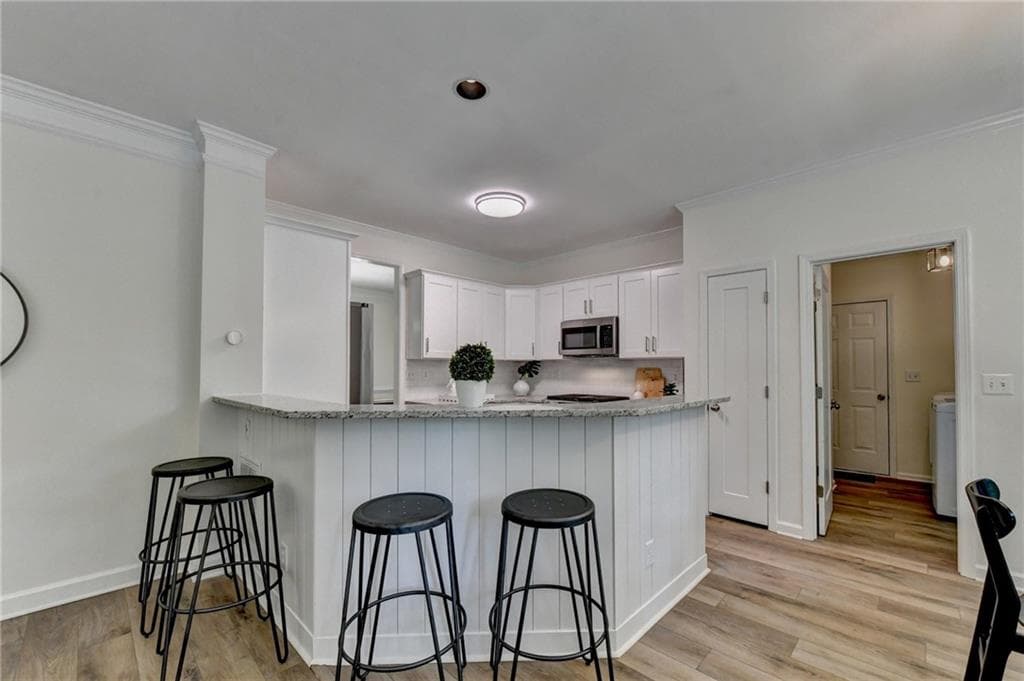 4 bedroom, 4 bathroom, 2,500 sq ft single family residence for sale at 150 Ashewoode Downs Lane, Johns Creek, GA 30005 — photo 7