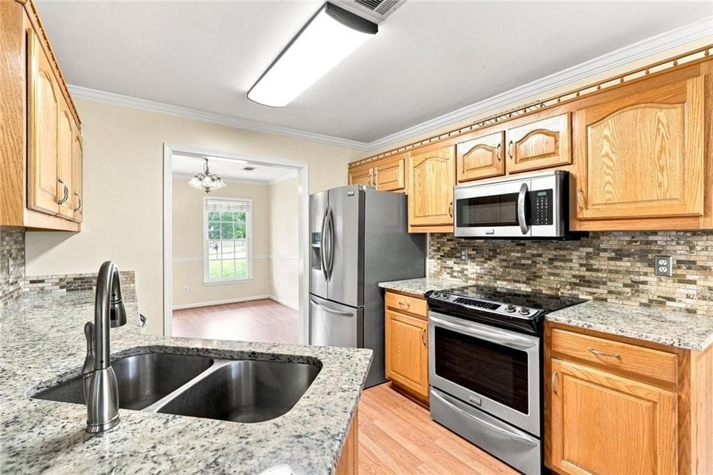 4 bedroom, 3 bathroom, 2,344 sq ft single family residence for sale at 2232 Woodbriar Drive, Buford, GA 30518 — photo 3