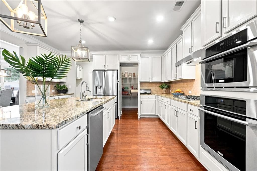 5 bedroom, 4 bathroom, 4,575 sq ft single family residence for sale at 412 Hathaway Avenue, Woodstock, GA 30188 — photo 9