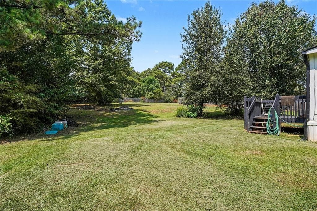 3 bedroom, 2 bathroom, 1,150 sq ft single family residence for sale at 915 Steele Drive, Hampton, GA 30228 — photo 2