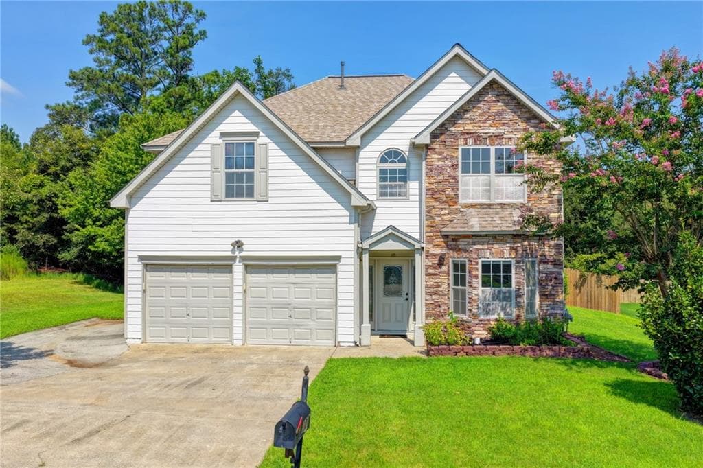 4 bedroom, 3 bathroom, 2,896 sq ft single family residence for sale at 220 Nichols Drive, Suwanee, GA 30024 — photo 2