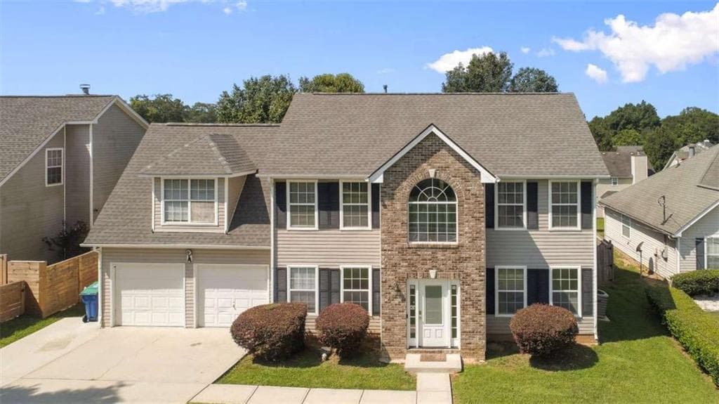 4 bedroom, 3 bathroom, 1,990 sq ft single family residence for sale at 6062 Lamp Post Place, Atlanta, GA 30349 — photo 1 of 50