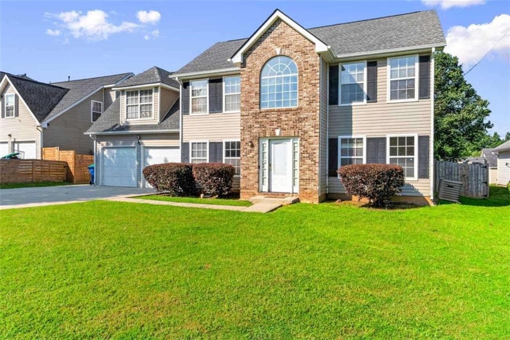 4 bedroom, 3 bathroom, 1,990 sq ft single family residence for sale at 6062 Lamp Post Place, Atlanta, GA 30349 — photo 3