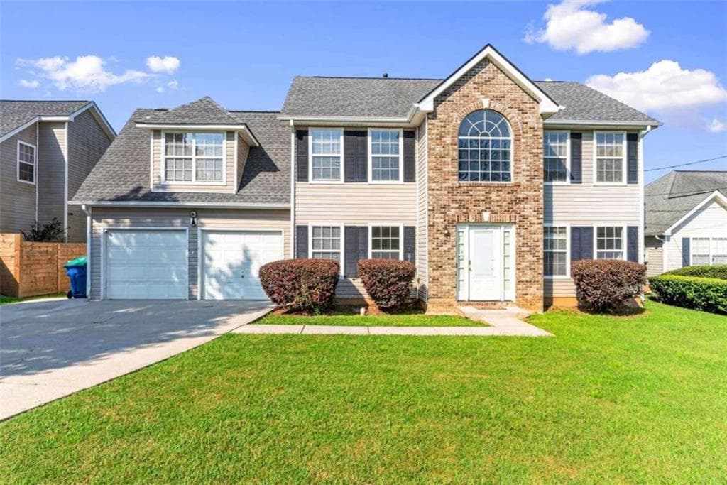 4 bedroom, 3 bathroom, 1,990 sq ft single family residence for sale at 6062 Lamp Post Place, Atlanta, GA 30349 — photo 4