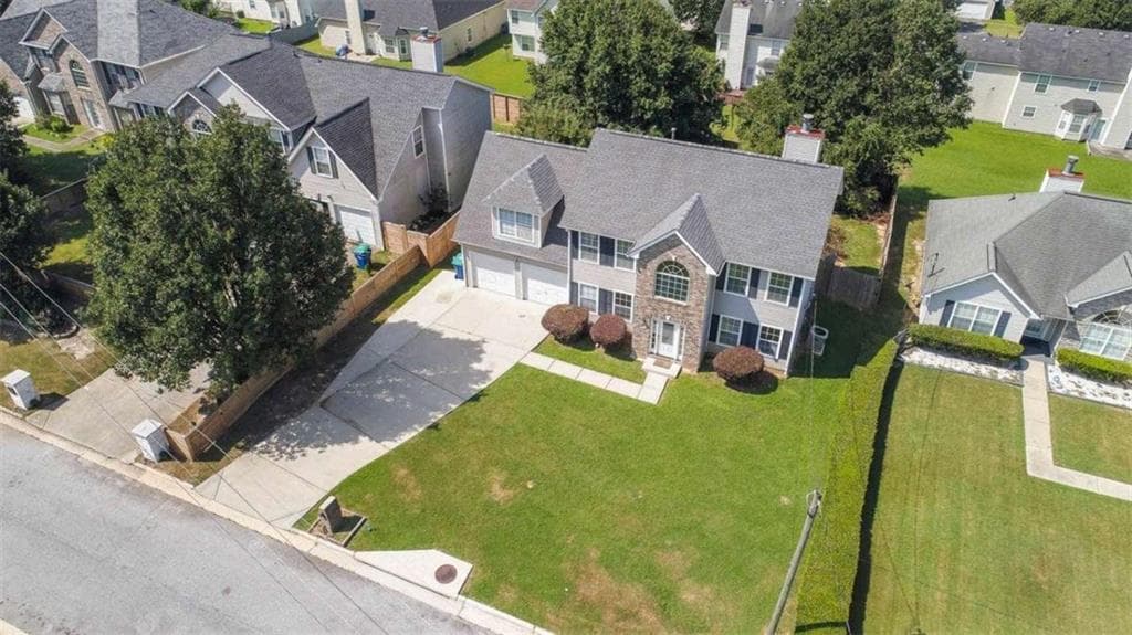 4 bedroom, 3 bathroom, 1,990 sq ft single family residence for sale at 6062 Lamp Post Place, Atlanta, GA 30349 — photo 5