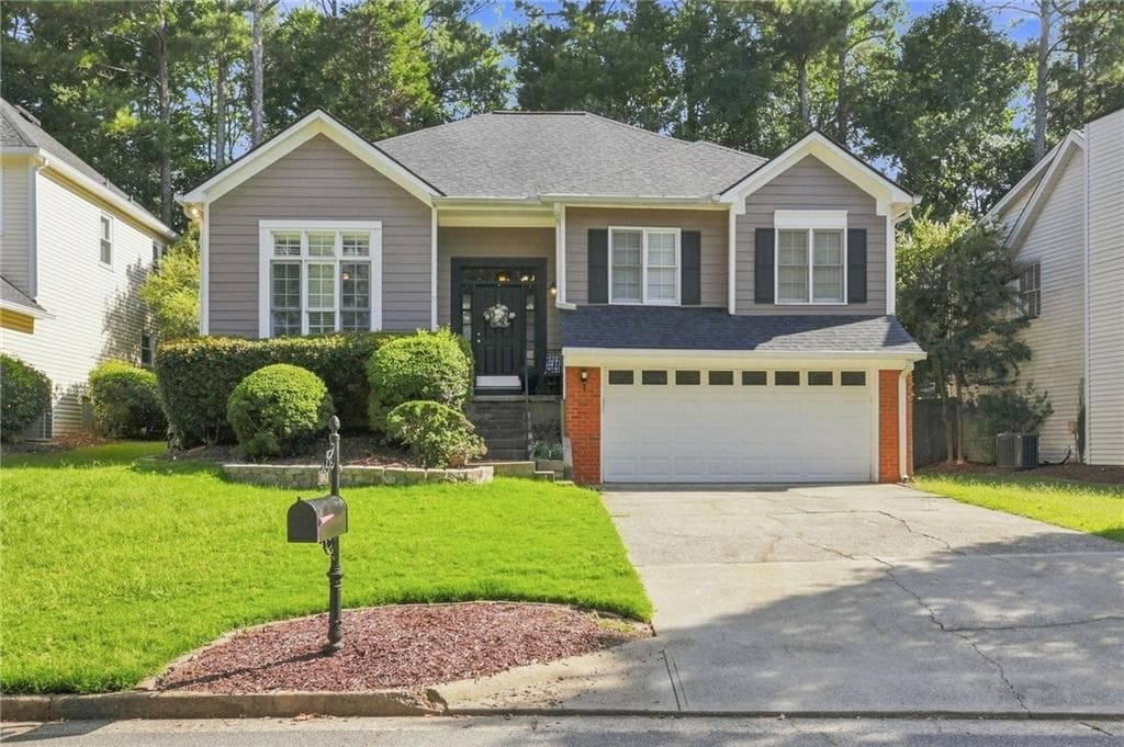 4 bedroom, 3 bathroom, 2,300 sq ft single family residence for sale at 8965 Club River Drive, Roswell, GA 30076 — photo 1 of 28