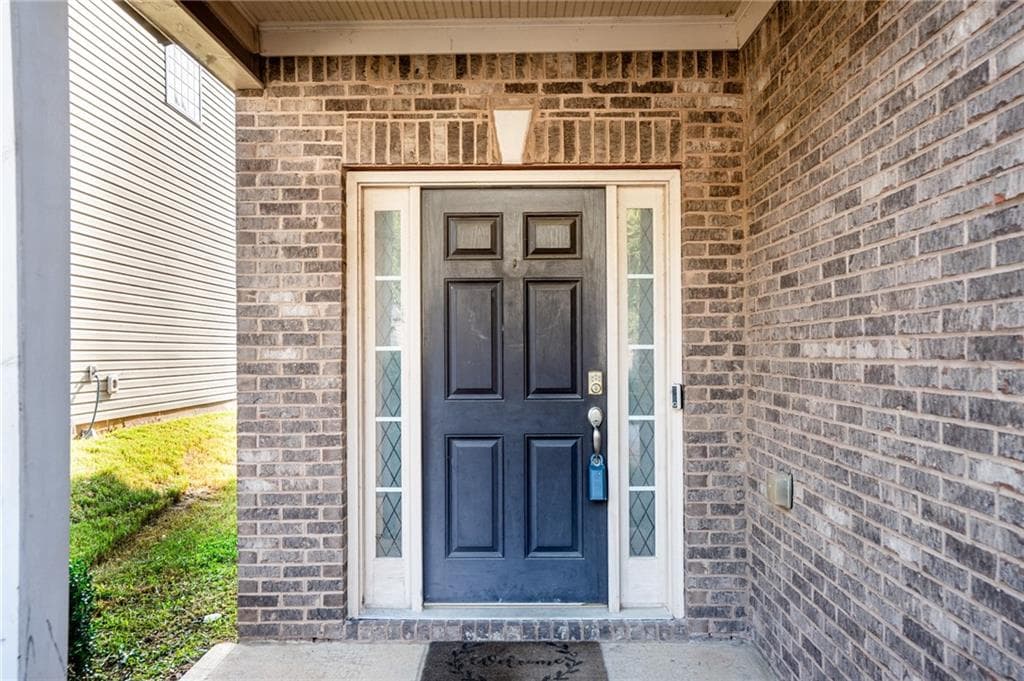 4 bedroom, 3 bathroom, 2,202 sq ft single family residence for sale at 5664 Grande River Road, Atlanta, GA 30349 — photo 3