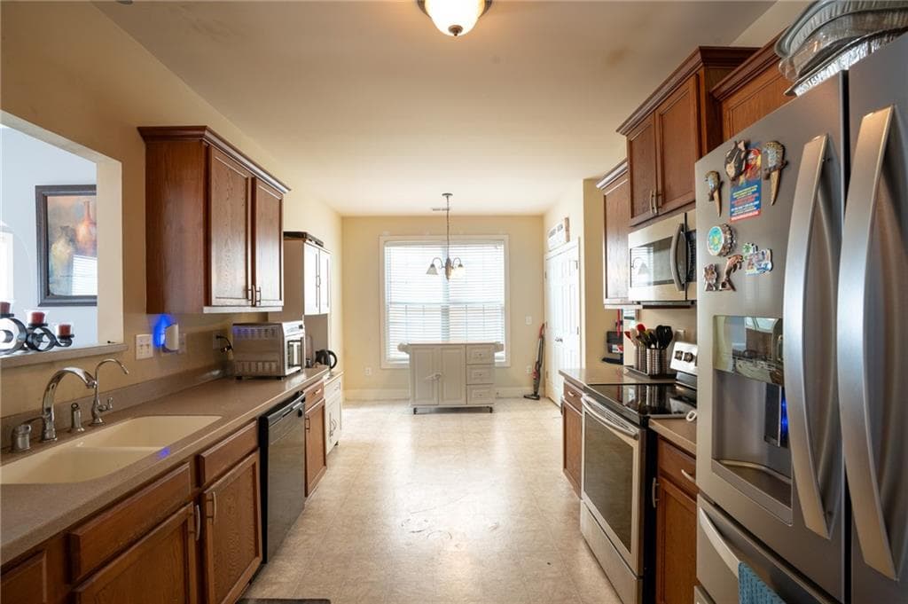 4 bedroom, 3 bathroom, 2,202 sq ft single family residence for sale at 5664 Grande River Road, Atlanta, GA 30349 — photo 9