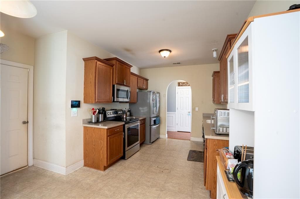 4 bedroom, 3 bathroom, 2,202 sq ft single family residence for sale at 5664 Grande River Road, Atlanta, GA 30349 — photo 10