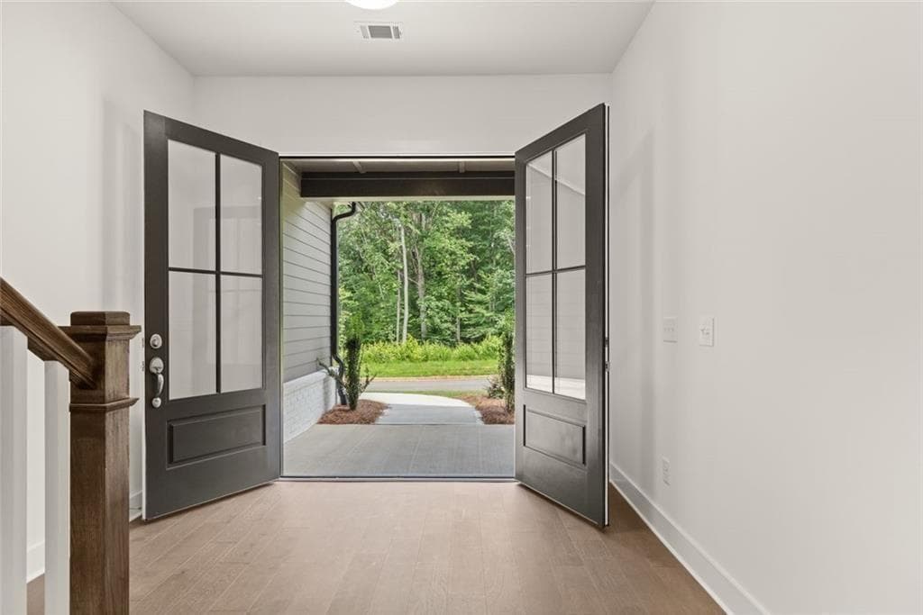 4 bedroom, 3 bathroom, 2,606 sq ft single family residence for sale at 8480 Creekside Overlook Drive, Gainesville, GA 30506 — photo 4