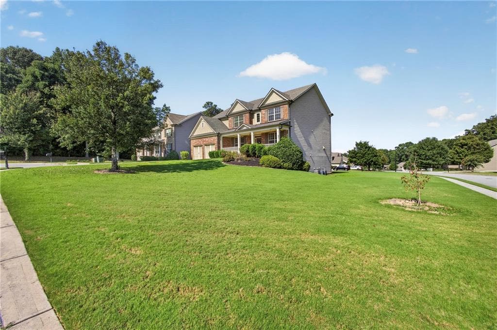 6 bedroom, 5 bathroom, 4,950 sq ft single family residence for sale at 3952 Ivy Gate Drive, Buford, GA 30519 — photo 2