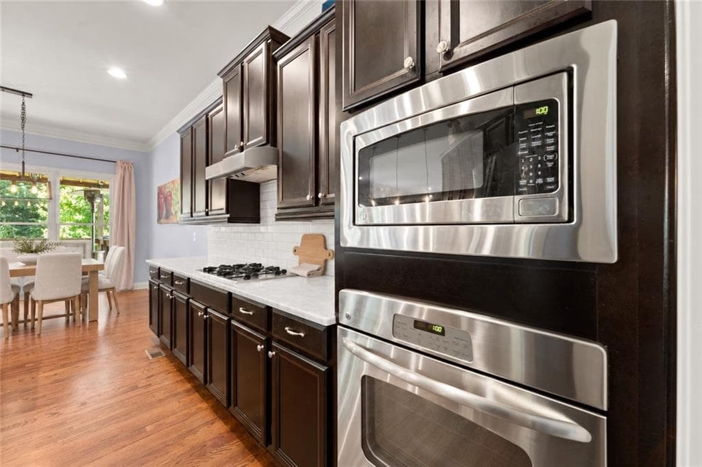 6 bedroom, 5 bathroom, 5,240 sq ft single family residence for sale at 11880 Old Station Place, Alpharetta, GA 30004 — photo 8