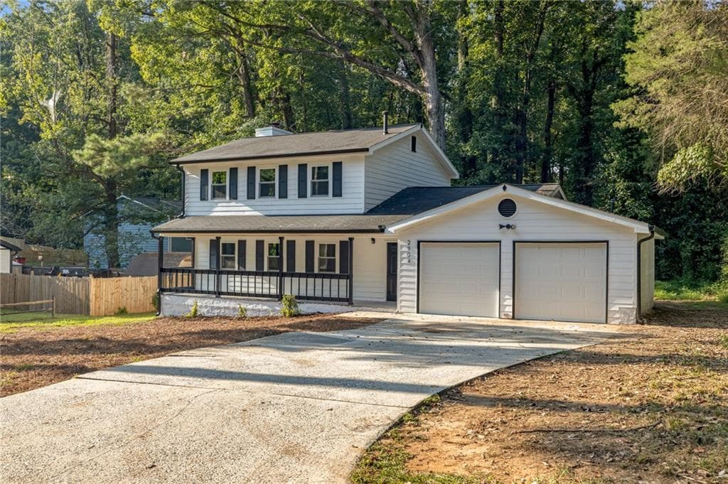 4 bedroom, 3 bathroom, 1,690 sq ft single family residence for sale at 2904 Wood Hollow Lane, Jonesboro, GA 30236 — photo 2