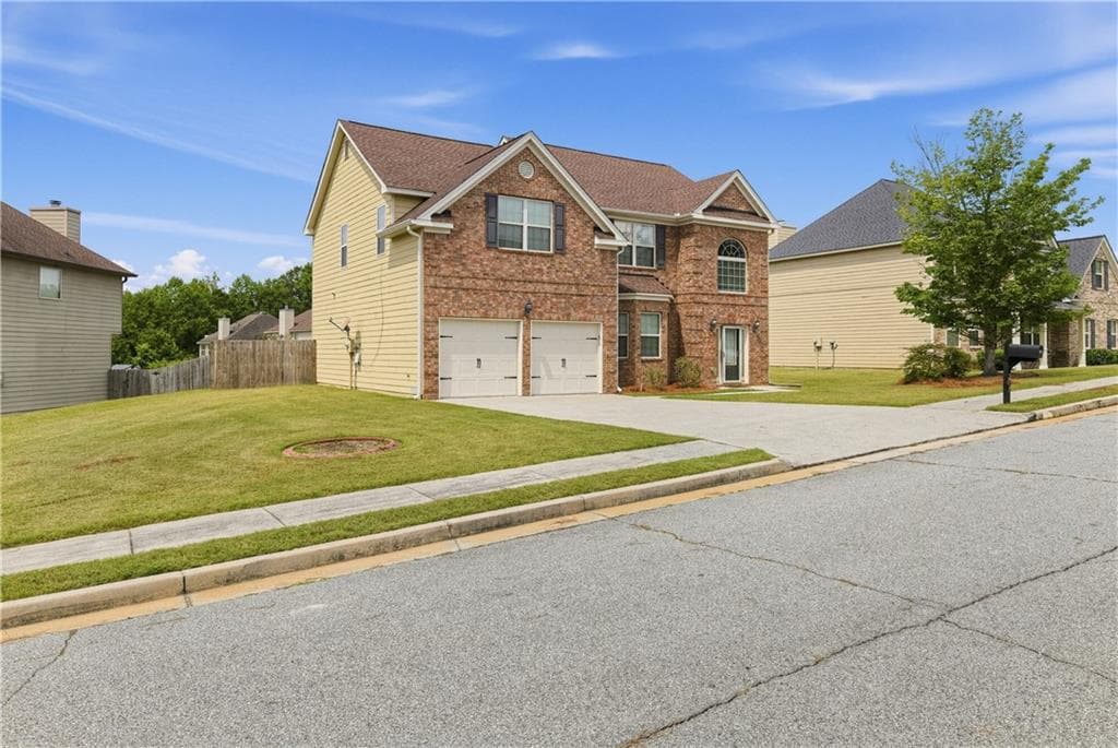 5 bedroom, 3 bathroom, 2,509 sq ft single family residence for sale at 217 Saintvry Path, Atlanta, GA 30349 — photo 3