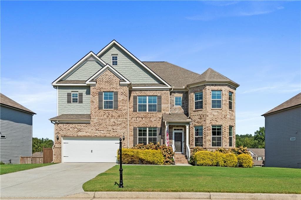 6 bedroom, 5 bathroom, 6,234 sq ft single family residence for sale at 7715 Tiberon Parkway, Cumming, GA 30028 — photo 2