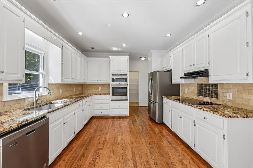 5 bedroom, 4 bathroom, 4,107 sq ft single family residence for sale at 2835 Live Oak Court, Cumming, GA 30041 — photo 6