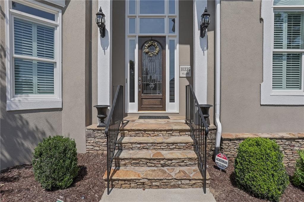 6 bedroom, 5 bathroom, 7,507 sq ft single family residence for sale at 10335 High Falls Circle, Alpharetta, GA 30022 — photo 2