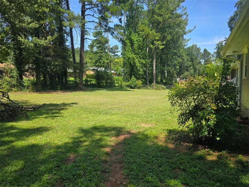4 bedroom, 3 bathroom, 1,919 sq ft single family residence for sale at 7379 Dexter Drive, Riverdale, GA 30296 — photo 7