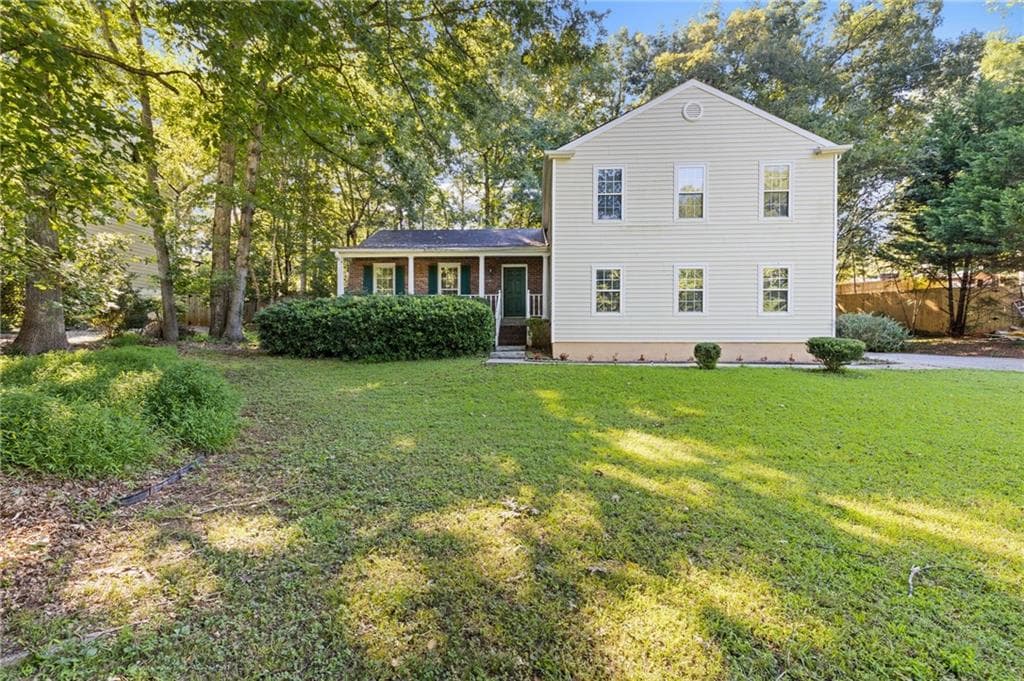 4 bedroom, 3 bathroom, 2,244 sq ft single family residence for sale at 3877 Peachtree Corners Circle, Peachtree Corners, GA 30092 — photo 1 of 28