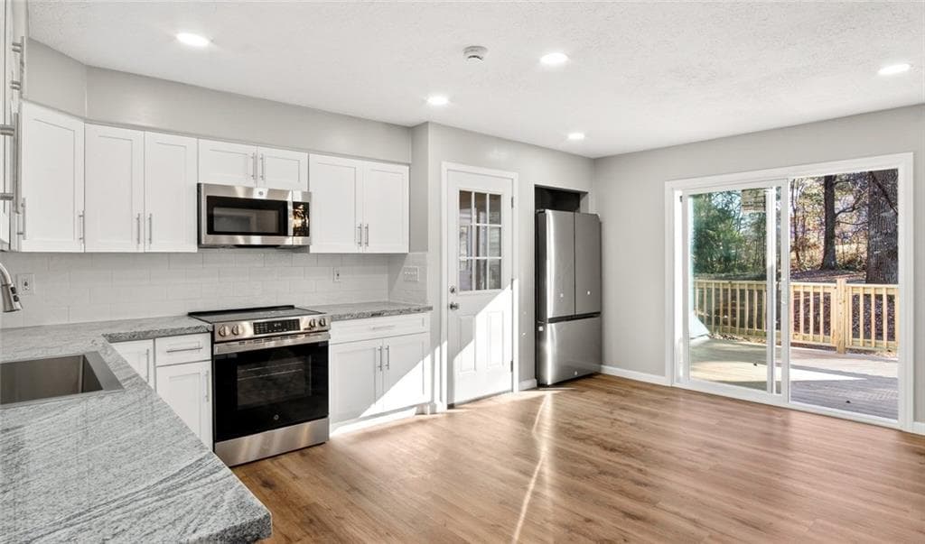 4 bedroom, 3 bathroom, 2,440 sq ft single family residence for sale at 1837 Coventry Way, Jonesboro, GA 30236 — photo 4