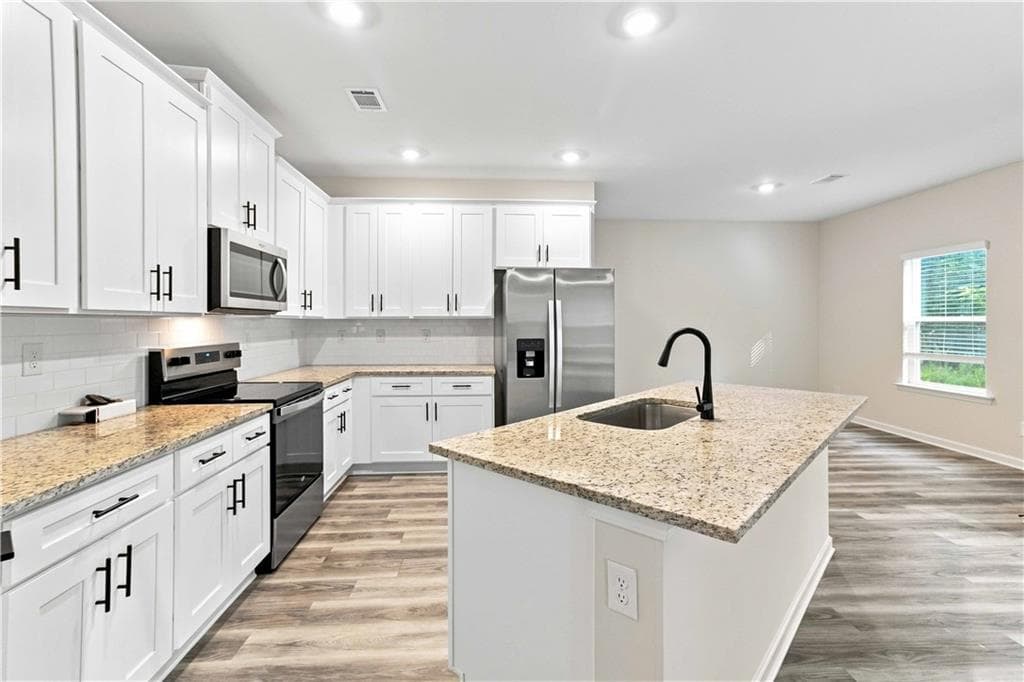 5 bedroom, 3 bathroom, 2,643 sq ft single family residence for sale at 3220 Azteca Way, Dacula, GA 30019 — photo 5