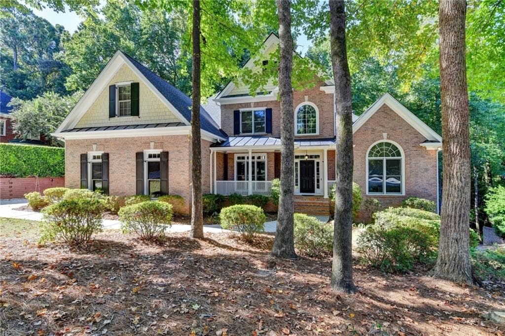 6 bedroom, 5 bathroom, 6,433 sq ft single family residence for sale at 4390 Laurel Grove Trace, Suwanee, GA 30024 — photo 2