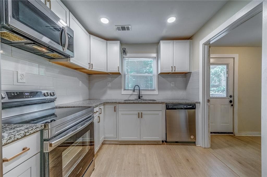 4 bedroom, 2 bathroom, 1,400 sq ft single family residence for sale at 1024 Regis Road, Atlanta, GA 30315 — photo 6