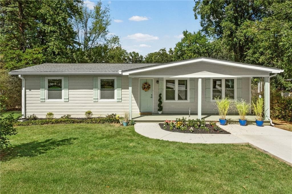 4 bedroom, 2 bathroom, 1,150 sq ft single family residence for sale at 2406 Woodland Drive, Kennesaw, GA 30152 — photo 1 of 31
