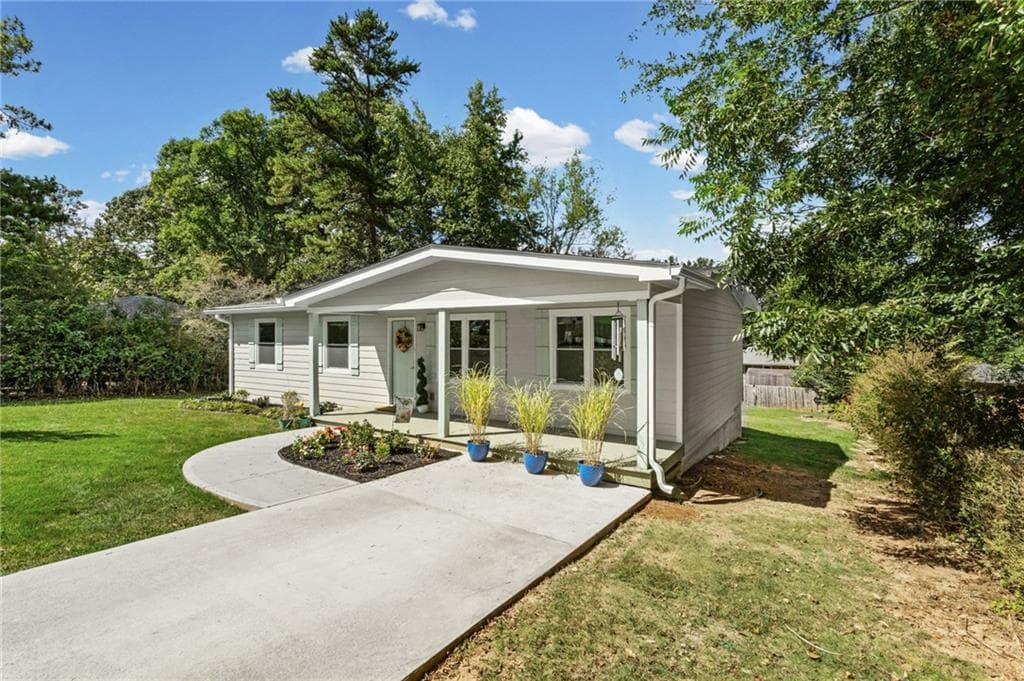 4 bedroom, 2 bathroom, 1,150 sq ft single family residence for sale at 2406 Woodland Drive, Kennesaw, GA 30152 — photo 2