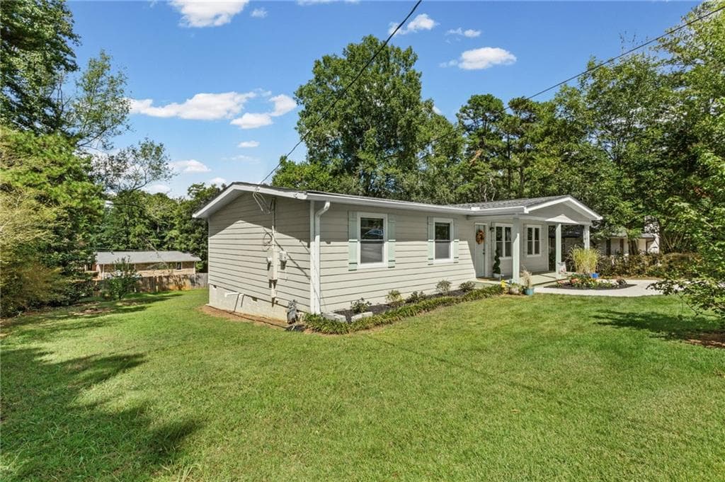 4 bedroom, 2 bathroom, 1,150 sq ft single family residence for sale at 2406 Woodland Drive, Kennesaw, GA 30152 — photo 3