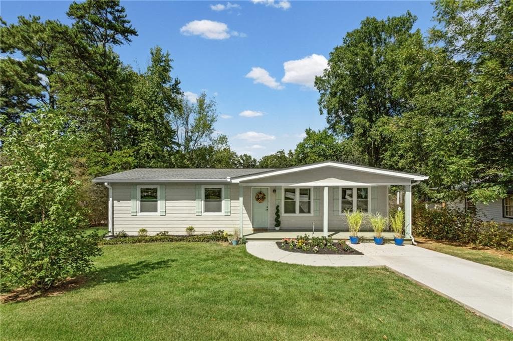 4 bedroom, 2 bathroom, 1,150 sq ft single family residence for sale at 2406 Woodland Drive, Kennesaw, GA 30152 — photo 4