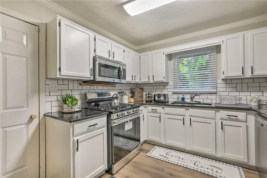 3 bedroom, 2 bathroom, 1,399 sq ft single family residence for sale at 2671 Collier Drive, Atlanta, GA 30318 — photo 9