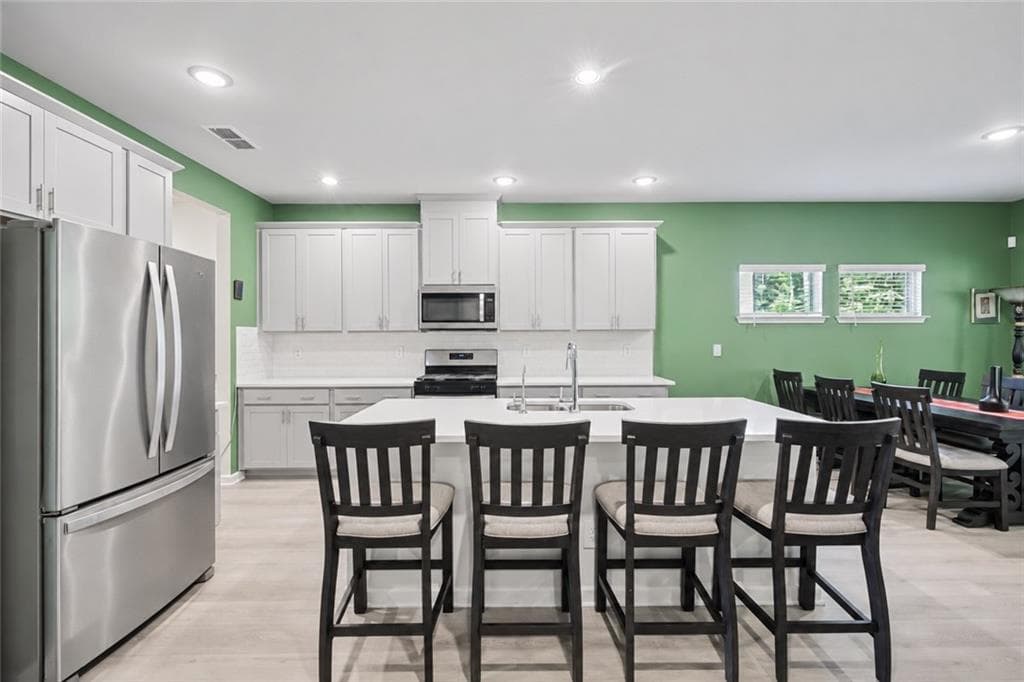 5 bedroom, 4 bathroom, 3,221 sq ft single family residence for sale at 7747 Richmond Trail, South Fulton, GA 30213 — photo 2