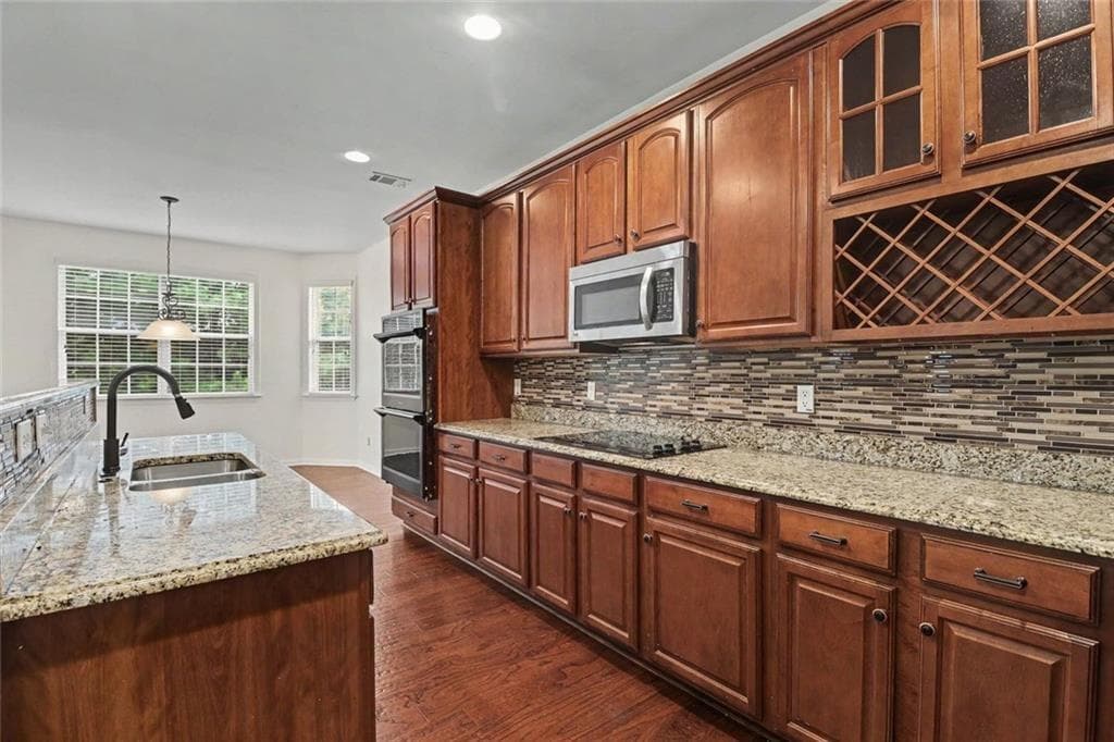 6 bedroom, 4 bathroom, 3,971 sq ft single family residence for sale at 6195 Park Leaf Walk, Buford, GA 30518 — photo 10