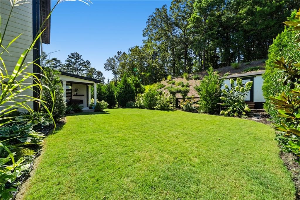 4 bedroom, 3 bathroom, 2,600 sq ft single family residence under contract at 8020 Veranda Curve, Ball Ground, GA 30107 — photo 2
