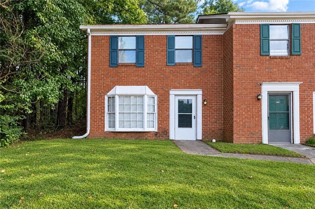 2 bedroom, 3 bathroom, 1,216 sq ft townhouse for sale at 1867 Mcelvaney Lane, Lawrenceville, GA 30044 — photo 1 of 29