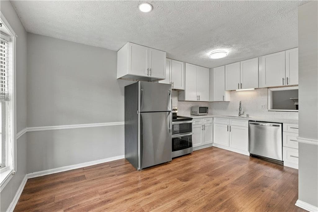 2 bedroom, 3 bathroom, 1,216 sq ft townhouse for sale at 1867 Mcelvaney Lane, Lawrenceville, GA 30044 — photo 6